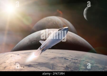 Starship taking off on a mission on background of alien planets in the outer space. Elements of this image furnished by NASA. Stock Photo
