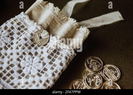A coin purse and with coins on the side Stock Photo