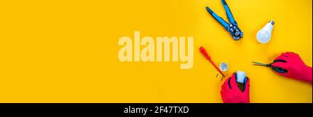 Electrical installation measuring instruments tools on a yellow background with copy space. place for text. Selective focus Stock Photo