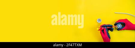 Electrical installation measuring instruments tools on a yellow background with copy space. place for text. Selective focus Stock Photo