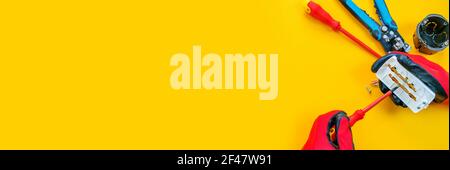 Electrical installation measuring instruments tools on a yellow background with copy space. place for text. Selective focus Stock Photo