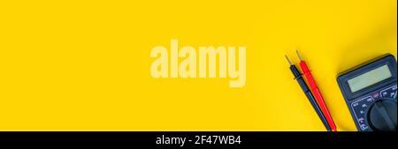 Electrical installation measuring instruments tools on a yellow background with copy space. place for text. Selective focus Stock Photo