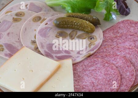 charcuterie and raclette cheese Stock Photo