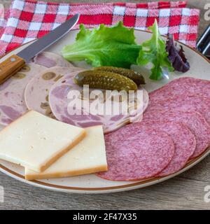 charcuterie and raclette cheese Stock Photo