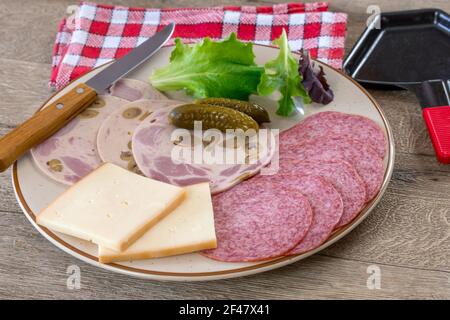 charcuterie and raclette cheese Stock Photo