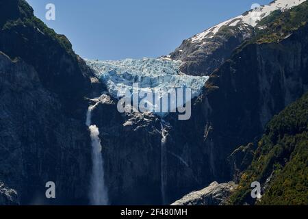 Sunset of Ventisquero Colgante, a hanging Glacier with waterfall and lake in queulat national park along the carretera austral in Patagonia, Chile, So Stock Photo