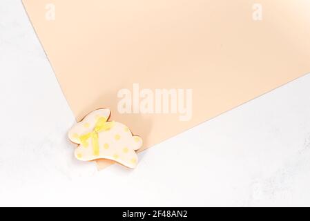 Easter bunny cookies on a double beige background Stock Photo