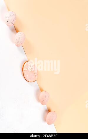 Pink pastel eggs and iced cookies on double background Easter greeting card concept Stock Photo