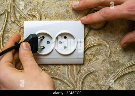 Repair of the socket, socket. Tools, voltage measuring devices. selective focus. Stock Photo