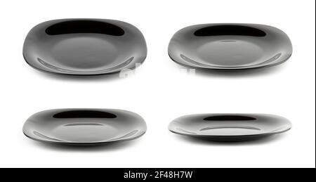 Set of empty black plates isolated on white background with different angle of view Stock Photo