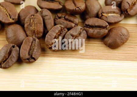 Roasted coffee beans on wooden with place for your text Stock Photo