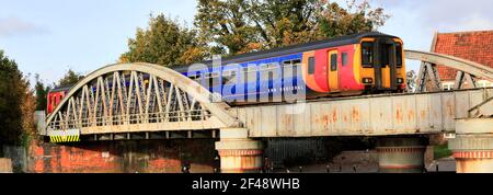 156404 East Midlands Railway Regional, on the river Witham bridge, Boston town, Lincolnshire County, England, UK Stock Photo