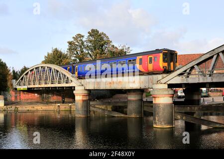 156404 East Midlands Railway Regional, on the river Witham bridge, Boston town, Lincolnshire County, England, UK Stock Photo