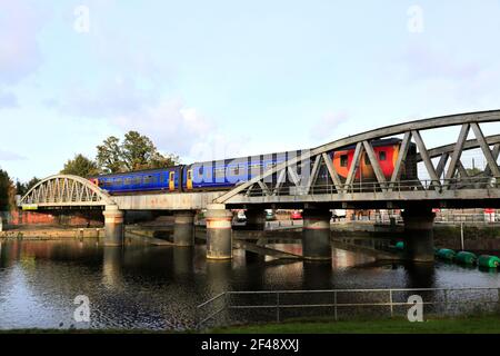 156404 East Midlands Railway Regional, on the river Witham bridge, Boston town, Lincolnshire County, England, UK Stock Photo