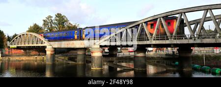 156404 East Midlands Railway Regional, on the river Witham bridge, Boston town, Lincolnshire County, England, UK Stock Photo