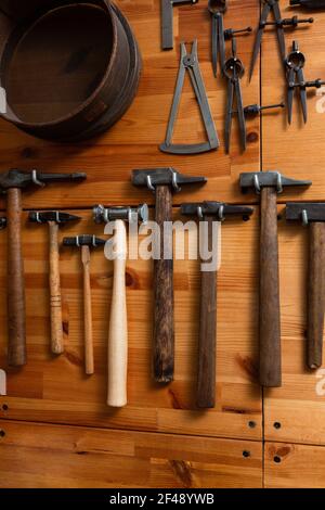 tool board of a jeweler's workshop, with hammers, compasses and vernier caliper Stock Photo