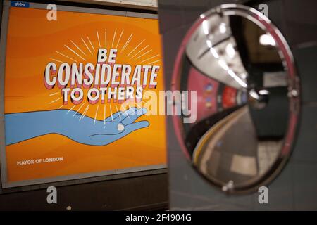 London, UK, 19 March 2021: London, UK, 19 March 2021: Posters on tube platforms encourage kind behaviour but also mask a collapse in TfL's advertising revenue. Anna Watson/Alamy Live News Stock Photo