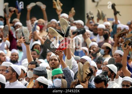 Dhaka, Dhaka, Bangladesh. 19th Mar, 2021. March, 19, 2021 Bangladeshi protesters raise their footwear and shout slogans during a protest after Friday prayers, against the visit of Indian Prime Minister Narendra Modi in Dhaka, Bangladesh Credit: Harun-Or-Rashid/ZUMA Wire/Alamy Live News Stock Photo