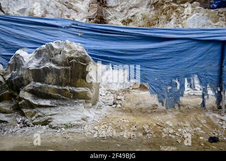 Stone texture background on rock mining. Rocky soil in a cut. Stock Photo
