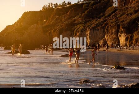 Malibu, CA USA - March 1st, 2021: Sunset view of people having fun on El Matador Beach Stock Photo