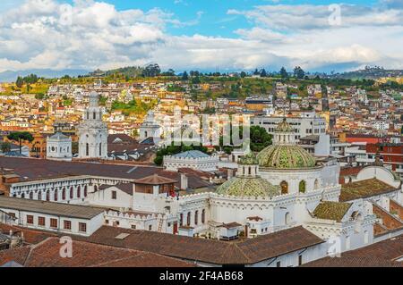 Aerial cityscape of the historic city center of Quito with the Compania de Jesus church dome, Ecuador. Stock Photo