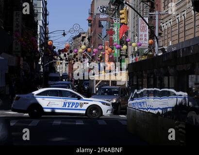 New York, United States. 19th Mar, 2021. An NYPD Police vehicle crosses Mott Street in Chinatown under and around Chinese street decorations in New York City on Friday, March 19, 2021. President Biden on Friday urged Congress to pass hate crime legislation to address the increase in discrimination and violence against Asian Americans during the COVID-19 pandemic. Photo by John Angelillo/UPI Credit: UPI/Alamy Live News Stock Photo