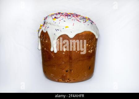 Easter holidays isolated sweet bread, paska decorated with sweet sugar icing on white background. Orthodox handmade kulich with topping. Spring holida Stock Photo