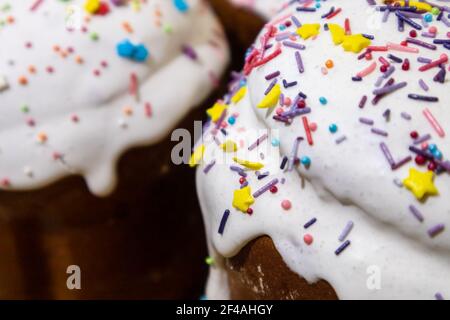Sugar icing decoration on easter spring holidays sweet bread, paska composition close-up with blurred background. Orthodox festive handmade kulich wit Stock Photo