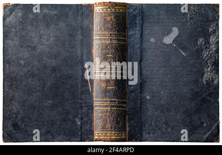 Old open book cover with worn textured grungy paper boards and wax drips, cracked embossed brown leather spine and abstract golden geometric decoratio Stock Photo