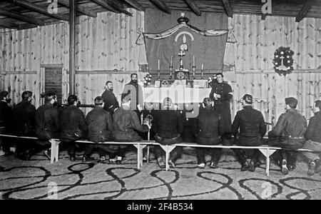 Russian prisoners seated in a chapel during services at Zossen prisoner of war camp, Wünsdorf, Zossen, Germany, during World War I ca. 1915 Stock Photo