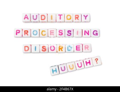 Auditory processing disorder and 'huuuh?' spelled out in colorful block letters. Concept for kids and adults with ADP or CAPD. Stock Photo