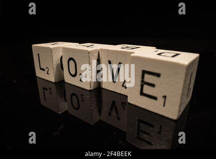 Letters on cubes write the word Love Stock Photo