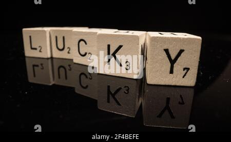 Letters on cubes write the word Lucky Stock Photo