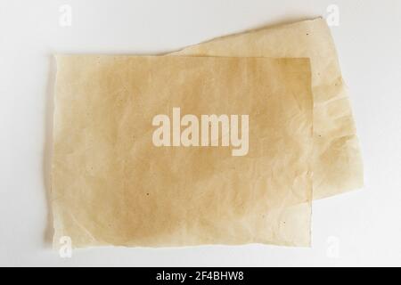 Baking paper sheet isolated on white background, top view. Parchment for baking culinary. Stock Photo
