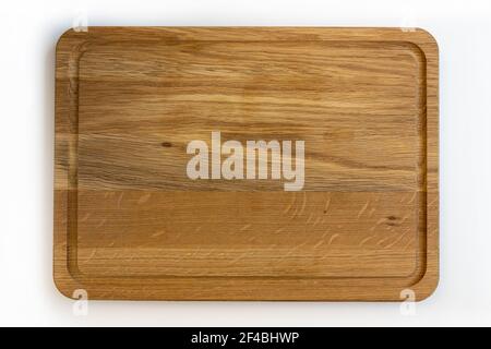 Used wooden chopping board, top view, isolated on white background. Stock Photo