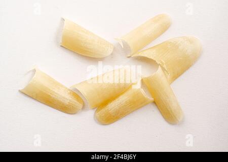 Clipped nails on white paper Stock Photo