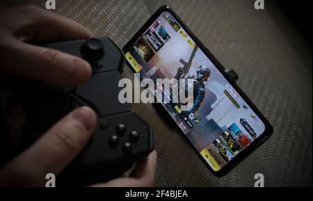 Belgrade, Serbia  March 19th, 2021: A Man Playing Call of Duty Mobile on Asus ROG Phone 5 Stock Photo