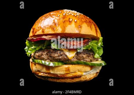 Isolated american burger on the black background Stock Photo