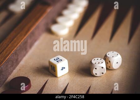 Set up backgammon game. Dice on a wooden board game. Selective focus Stock Photo