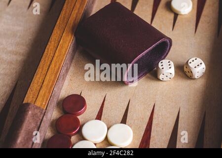 Playing backgammon game, dice on wooden board game Stock Photo