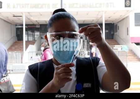 Non Exclusive: NEZAHUALCOYOTL, MEXICO - MARCH 19: Medical personnel prepare Sinovac Covid-19 vaccine injections for adults over 60 years of age at the Stock Photo