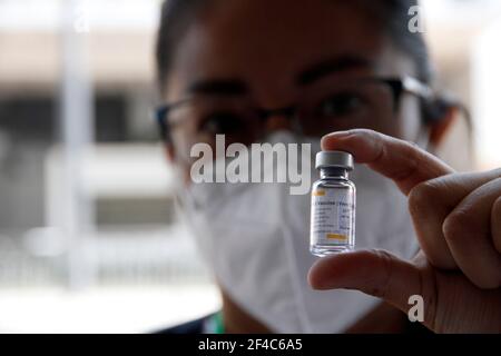 Non Exclusive: NEZAHUALCOYOTL, MEXICO - MARCH 19: Medical personnel prepare Sinovac Covid-19 vaccine injections for adults over 60 years of age at the Stock Photo