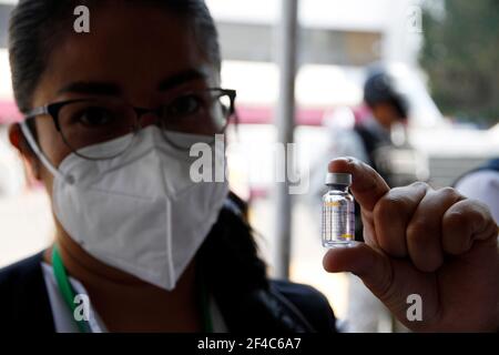 Non Exclusive: NEZAHUALCOYOTL, MEXICO - MARCH 19: Medical personnel prepare Sinovac Covid-19 vaccine injections for adults over 60 years of age at the Stock Photo