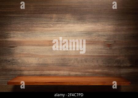Wooden shelf and wood background of wall texture. Brown book shelf at wall background with copy space Stock Photo