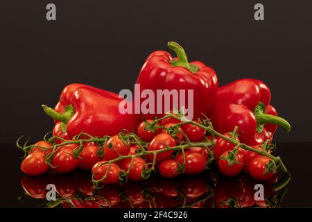 Red peppers with baby plum tomatoes,a healthy,colorful part of a mediterranean diet Stock Photo