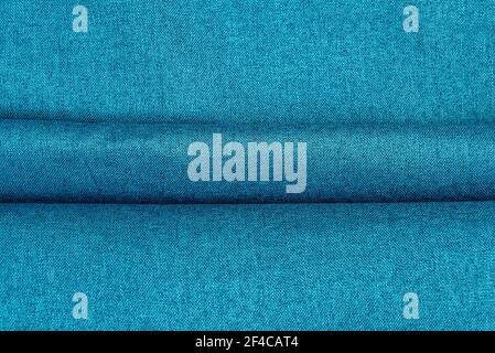 Part of the blue fabric texture. Fabric texture for background and design works of art, beautiful wrinkled pattern of wool or linen. A crumpled piece of cloth. Heavy, cozy and soft flannel Stock Photo