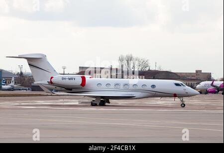 Ukraine, Kyiv - March 19, 2021: Plane Gulfstream G500 on the apron. Aircraft - 9H-MRV Chartered small white plane. Stock Photo