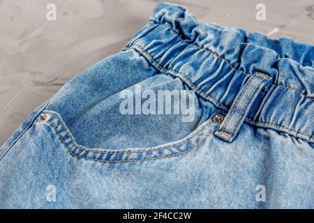 Close-up of blue jeans pocket showing fabric texture and stitching. Stock Photo