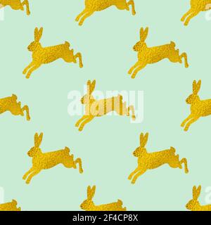 Golden Easter seamless pattern with rabbits on a green background. Vector illustration. Stock Vector