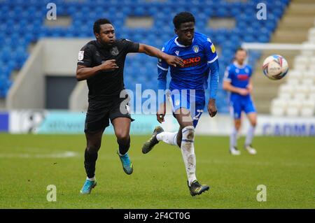 Colchesters Brendan Sarpong-Wiredu battling with Port Vales Emmauel Oyeleke during the Sky Bet League 2 match between Colchester United and Port Vale at the Weston Homes Community Stadium, Colchester on Saturday 20th March 2021. (Credit: Ben Pooley | MI News) Stock Photo